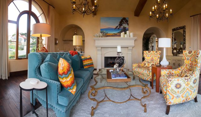 a living room with furniture and a fireplace