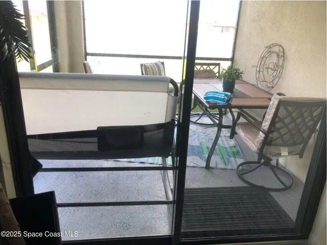 a view of table and chair with wooden floor