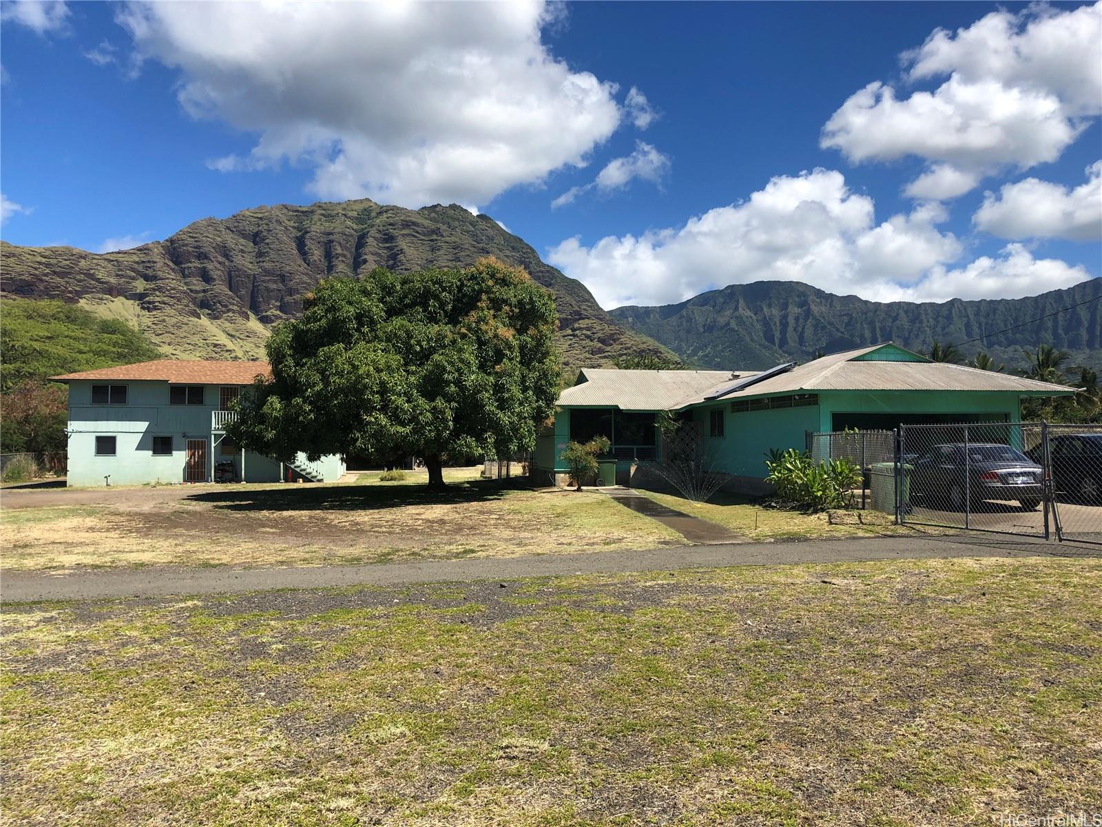 85-576 Waianae Valley Road, Unit A Waianae, HI 96792 - Photo 1 of 1 a view of a house with a yard and sitting area
