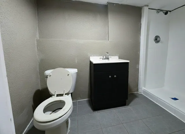 a bathroom with a toilet and a sink