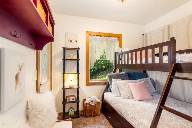 a bedroom with furniture and a book shelf