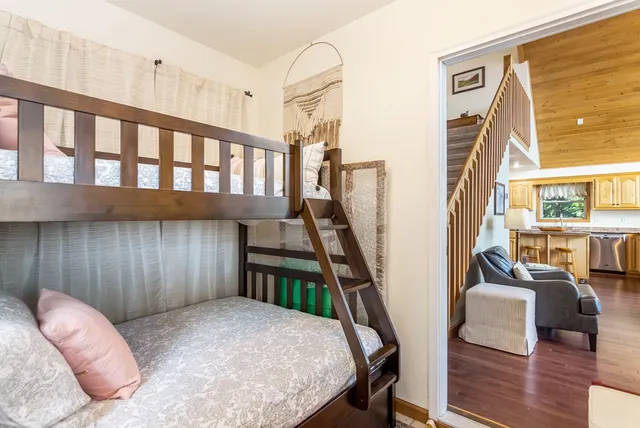 a kitchen with stainless steel appliances granite countertop a refrigerator a sink and a stove