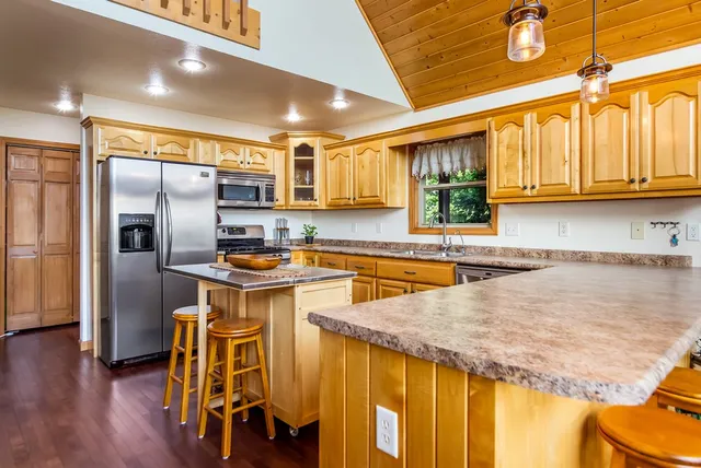 a living room with fireplace and furniture