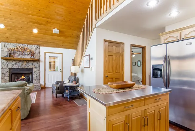 a bedroom with a bed couch and window