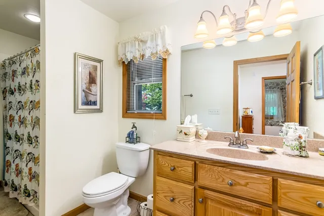 a bedroom with a bed and a table