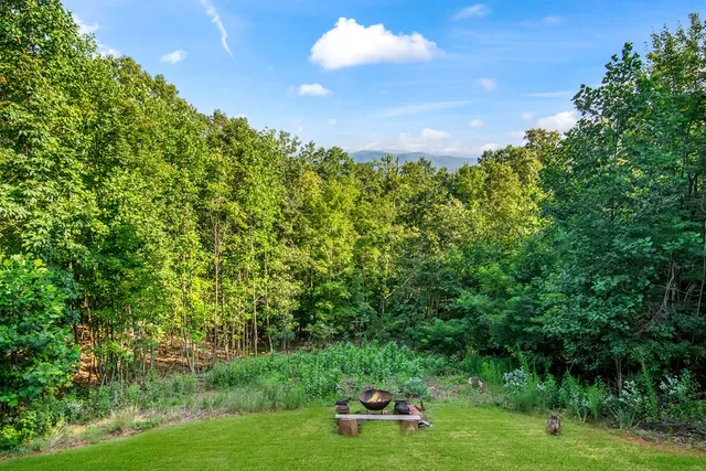 a view of a wooden deck with furniture