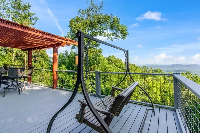 a view of a balcony with wooden floor