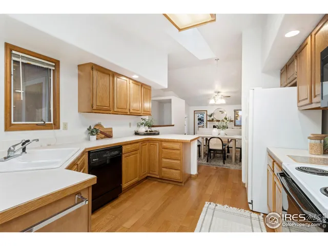 a kitchen with sink cabinets and stove