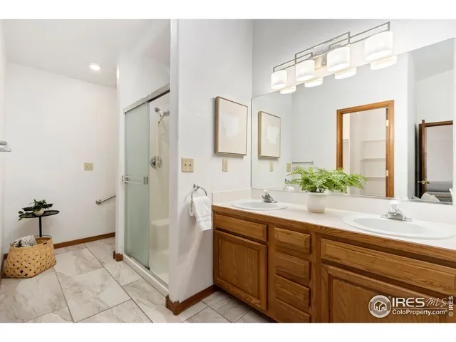 a bedroom with a bed table and a window