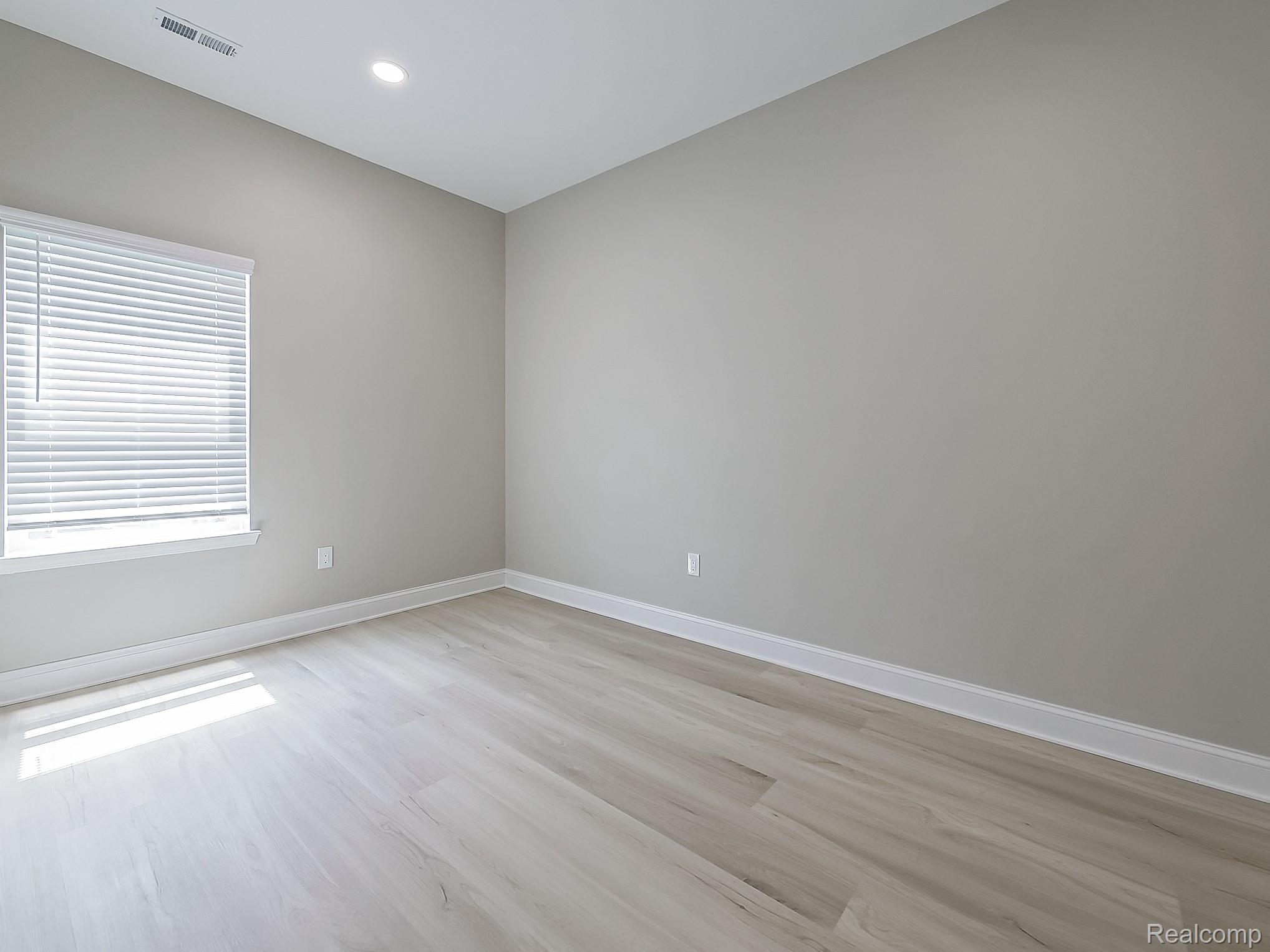31480 Warren Road, Unit 101 Westland, MI 48185 - Photo 7 of 26 Empty room with light wood-style flooring and recessed lighting