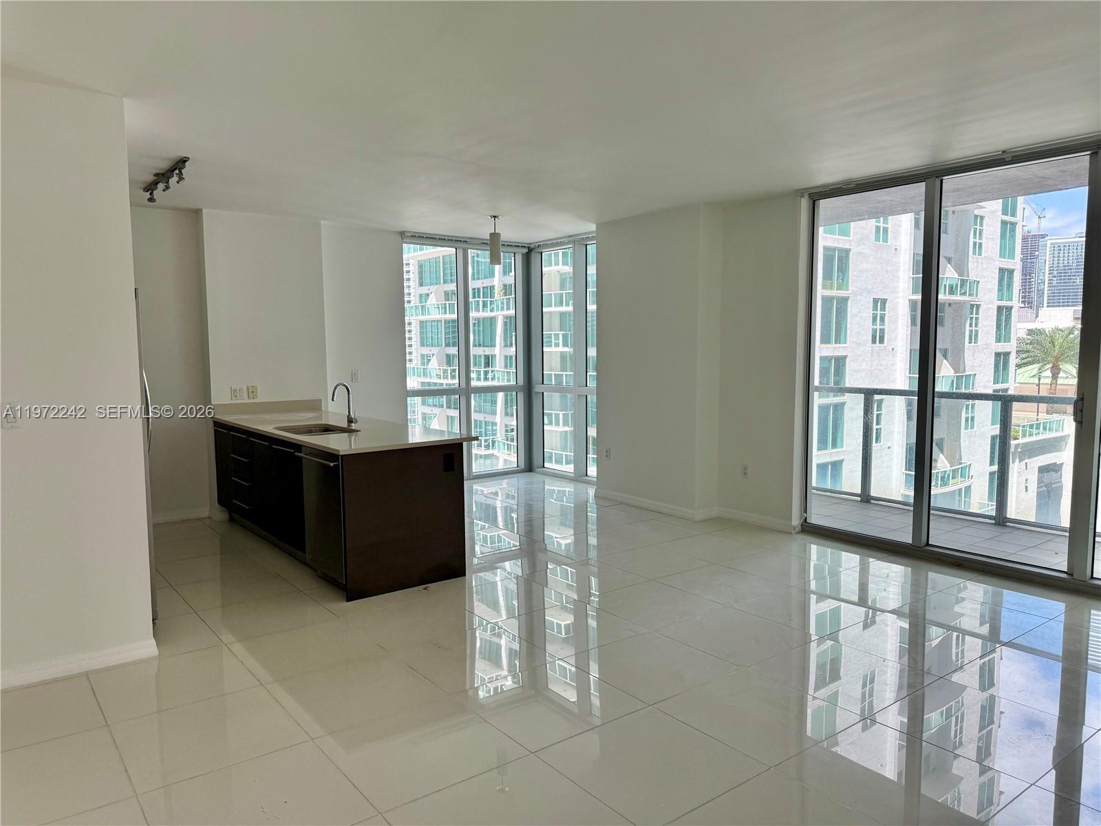 55 Southeast 6th Street, Unit 1201 Miami, FL 33131 - Photo 14 of 26 a room with a bed and a window
