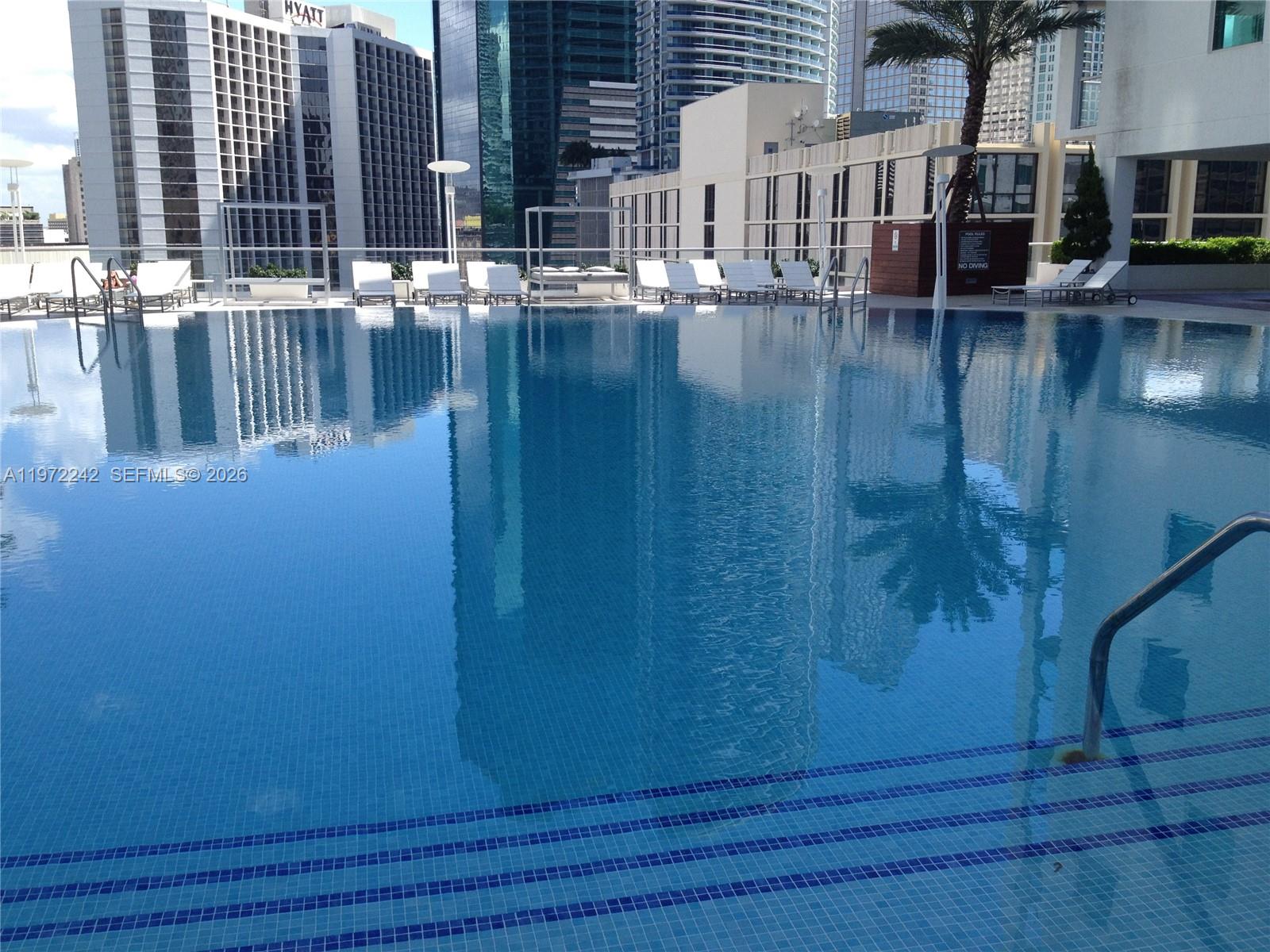 55 Southeast 6th Street, Unit 1201 Miami, FL 33131 - Photo 23 of 26 a view of pool with outdoor seating