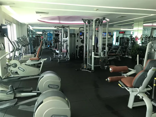 a room with lots of gym equipment
