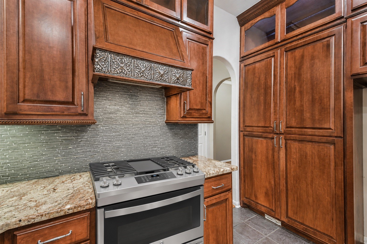20942 Wind Field Lane Spring, TX 77379 - Photo 18 of 46 a kitchen with stainless steel appliances granite countertop a stove and a refrigerator