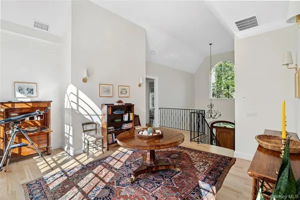a living room with furniture a rug and a fireplace