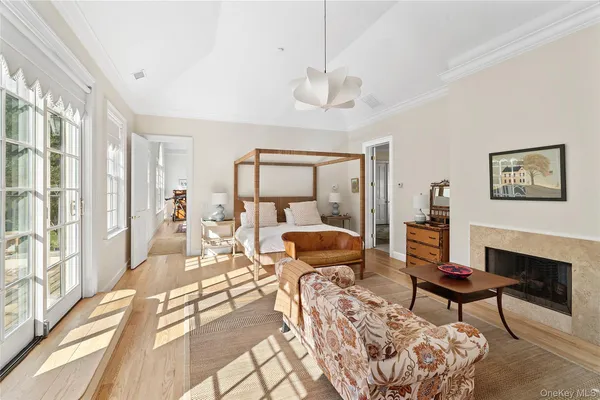 a living room with furniture large window and a table