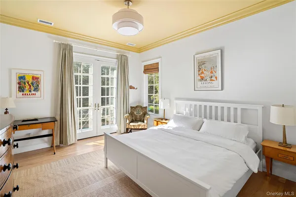 a bed room with a bed and a chair