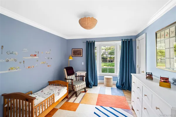 a bed room with a bed and a window