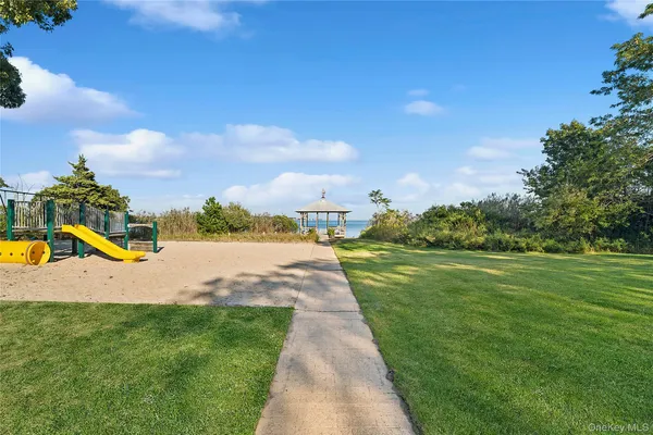 a view of a park with swings and slides