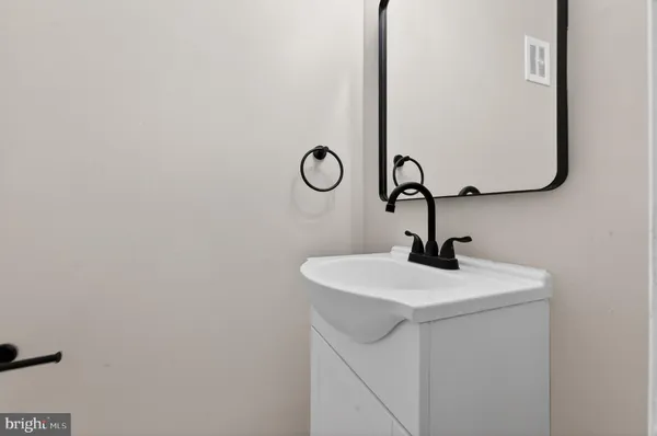 a close view of a sink a vanity and a window in a bathroom