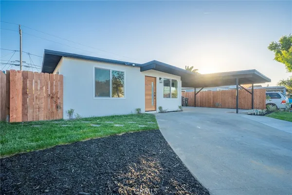 a house view with a backyard space
