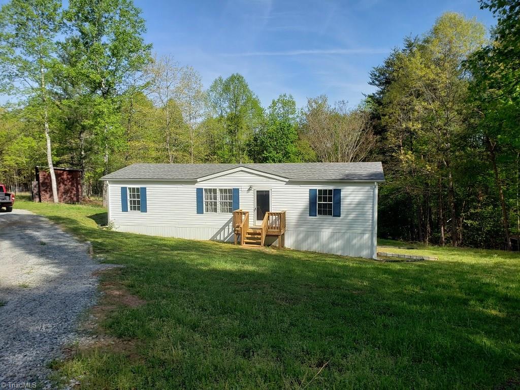 1578 Boone Gap Road Boomer, NC 28606 - Photo 2 of 30 Updated vinyl siding and underpinning. Storage building also included