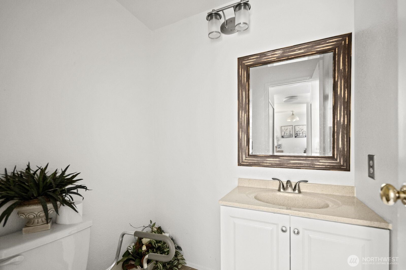 2100 South 336th Street, Unit G3 Federal Way, WA 98003 - Photo 12 of 27 a bathroom with a sink a mirror and vanity