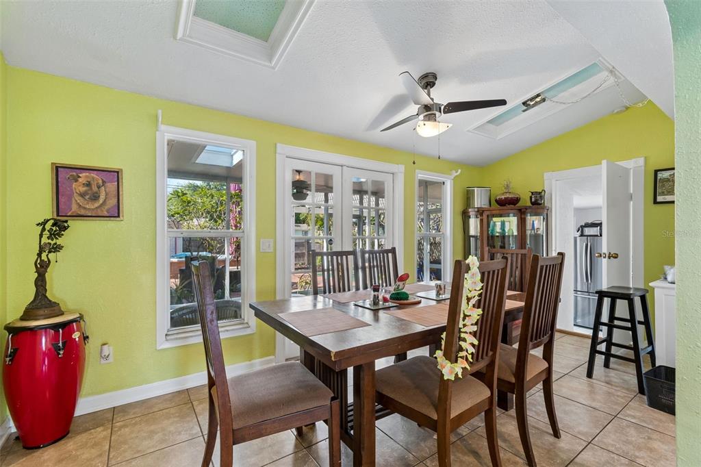 6226 8th Avenue South Gulfport, FL 33707 - Photo 14 of 46 a view of a dining room with furniture window and wooden floor