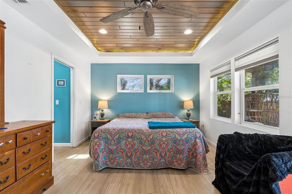 6226 8th Avenue South Gulfport, FL 33707 - Photo 18 of 46 a bedroom with a bed and wooden floor