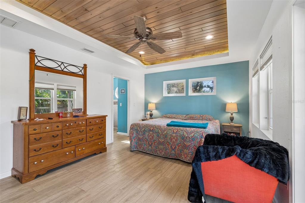 6226 8th Avenue South Gulfport, FL 33707 - Photo 19 of 46 a bedroom with a bed and wooden floor