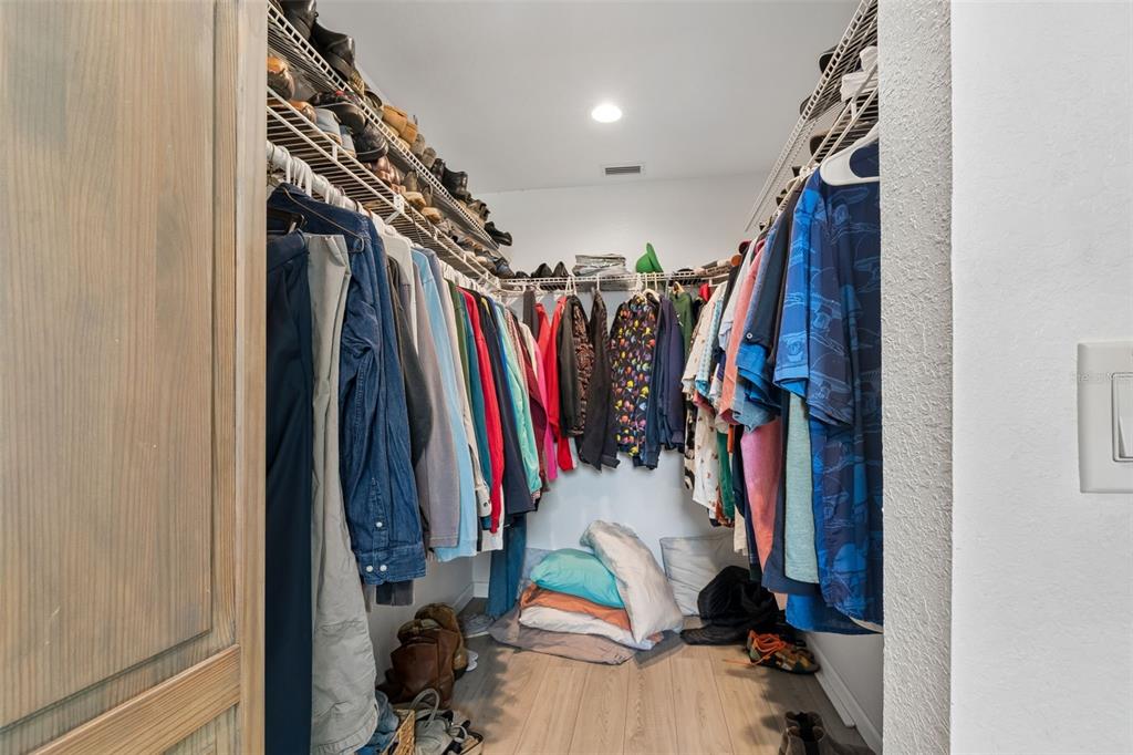 6226 8th Avenue South Gulfport, FL 33707 - Photo 23 of 46 a view of walk in closet with clothes