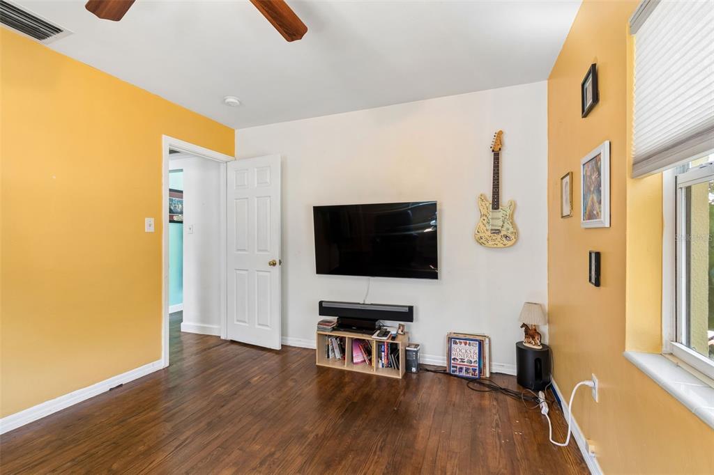 6226 8th Avenue South Gulfport, FL 33707 - Photo 24 of 46 a living room with fireplace furniture and a flat screen tv