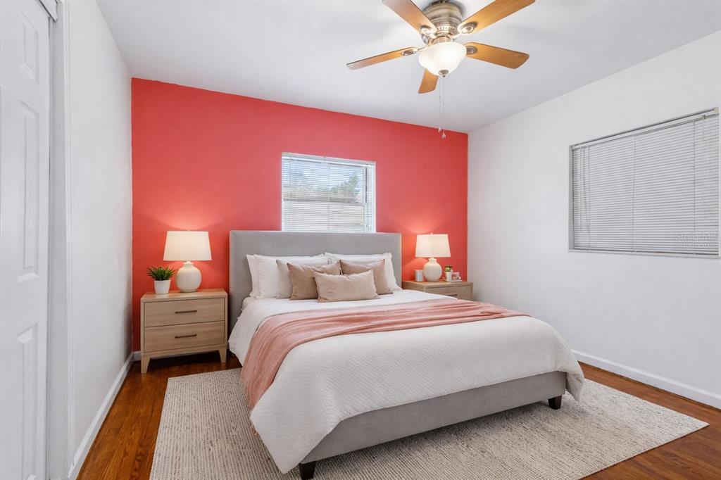 6226 8th Avenue South Gulfport, FL 33707 - Photo 28 of 46 a bedroom with a bed and a chandelier