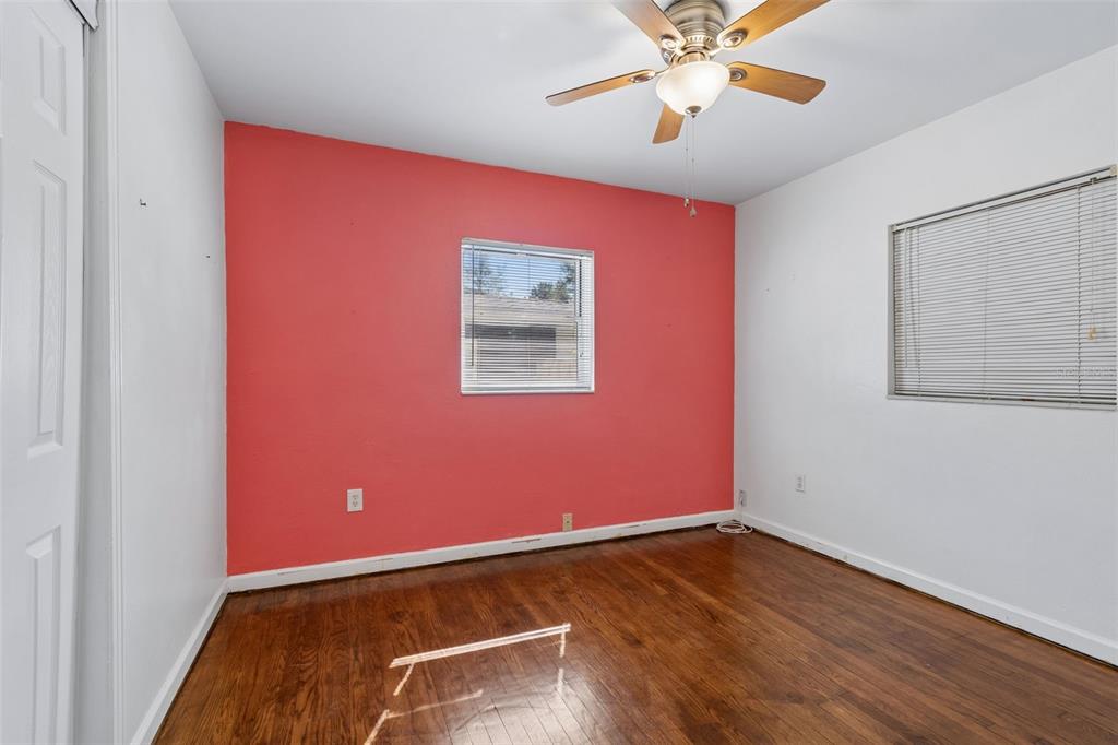 6226 8th Avenue South Gulfport, FL 33707 - Photo 29 of 46 an empty room with a ceiling fan and a window