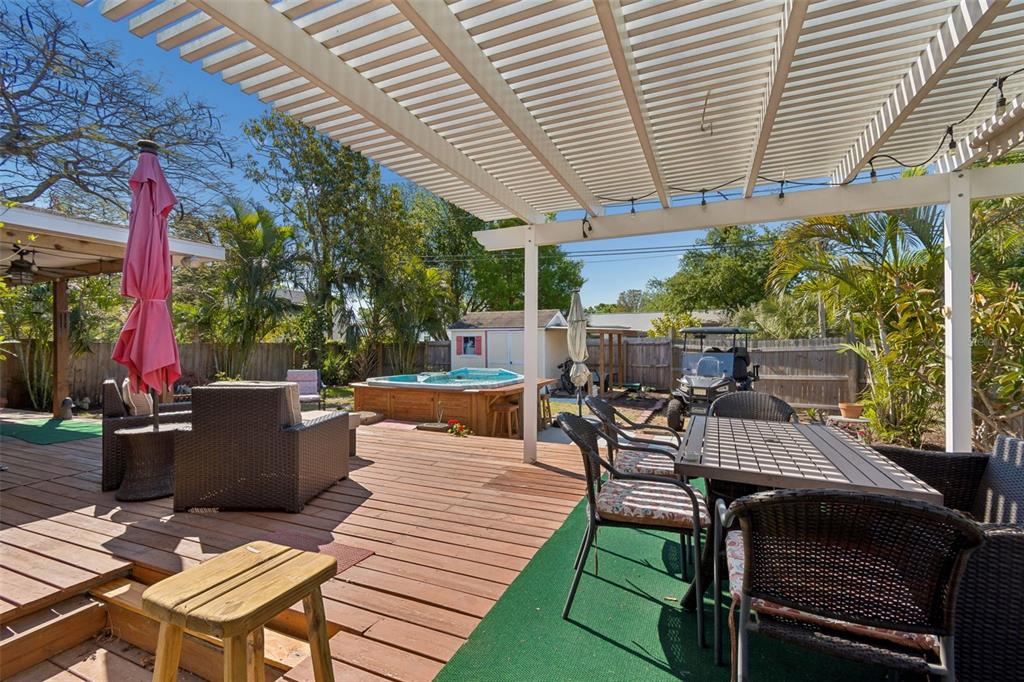 6226 8th Avenue South Gulfport, FL 33707 - Photo 35 of 46 a view of a patio with table and chairs and potted plants