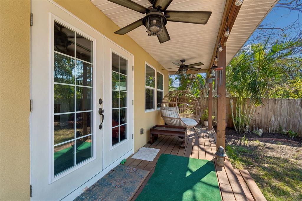 6226 8th Avenue South Gulfport, FL 33707 - Photo 38 of 46 a view of a porch with chairs and a yard