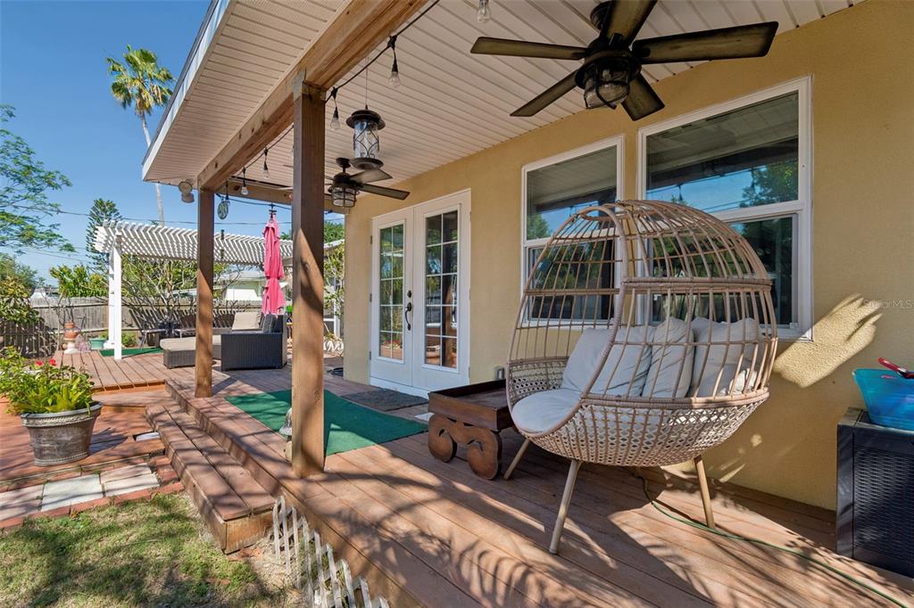 6226 8th Avenue South Gulfport, FL 33707 - Photo 39 of 46 a view of a patio with table and chairs and potted plants
