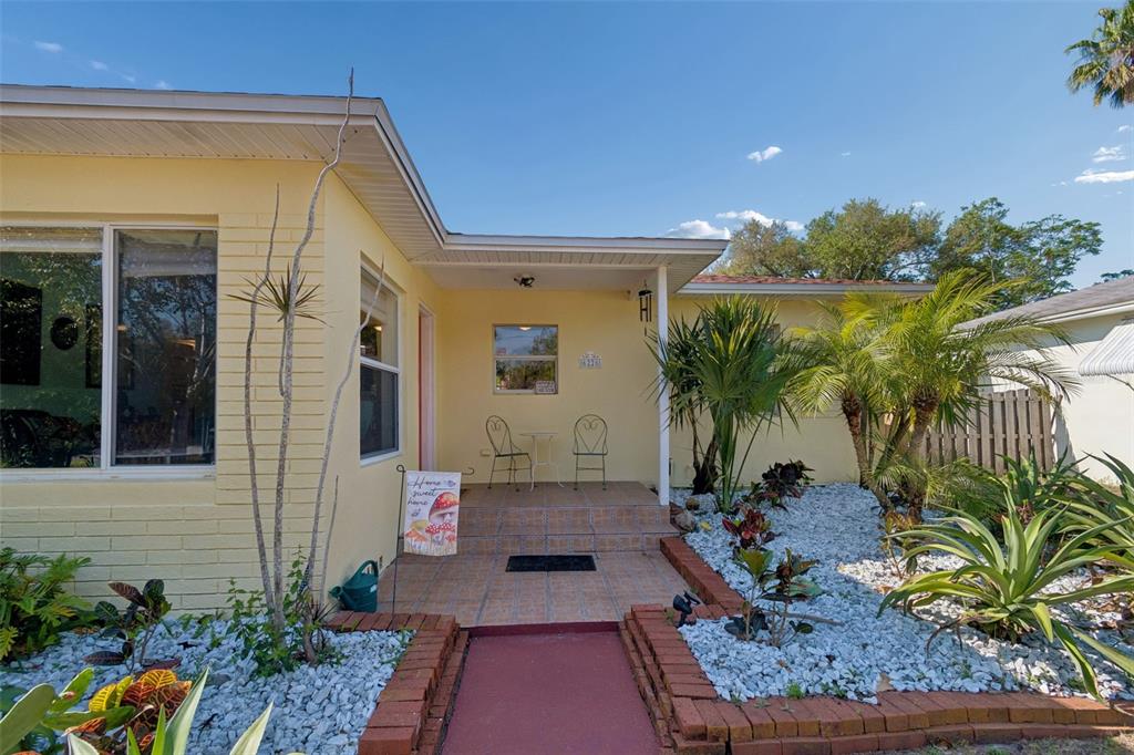 6226 8th Avenue South Gulfport, FL 33707 - Photo 4 of 46 a front view of a house with a yard