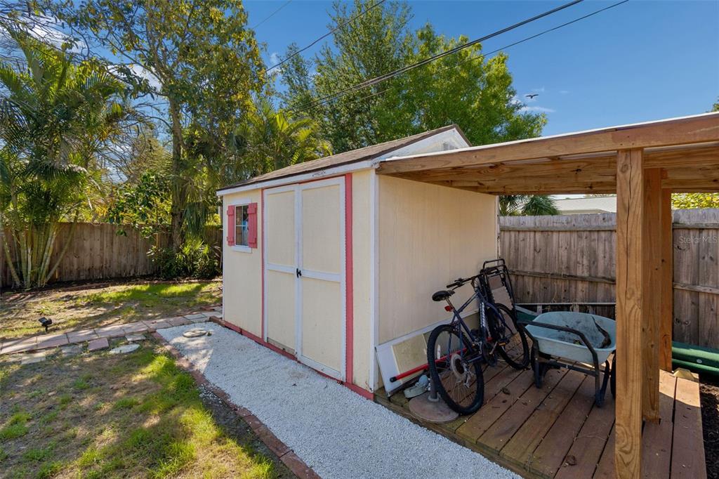 6226 8th Avenue South Gulfport, FL 33707 - Photo 42 of 46 a view of patio with table and chairs and wooden fence