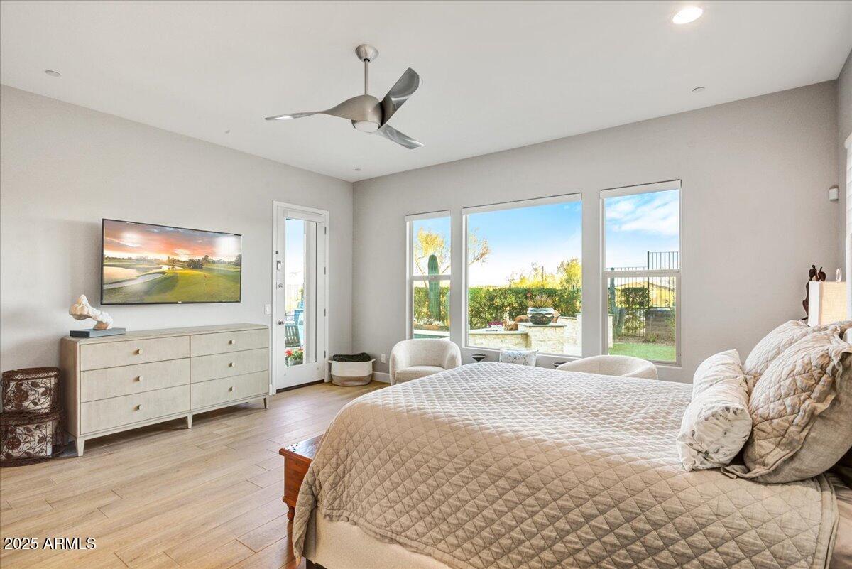 17833 East StockingTrail Rio Verde, AZ 85263 - Photo 16 of 45 a bedroom with a bed and a flat screen tv
