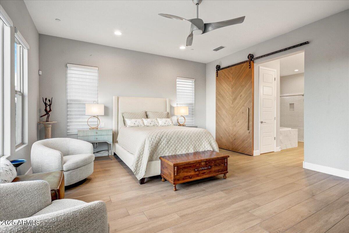 17833 East StockingTrail Rio Verde, AZ 85263 - Photo 17 of 45 a bedroom with bed and a large window