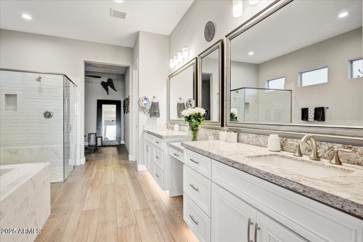 17833 East StockingTrail Rio Verde, AZ 85263 - Photo 19 of 45 a spacious bathroom with a granite countertop sink mirror and shower