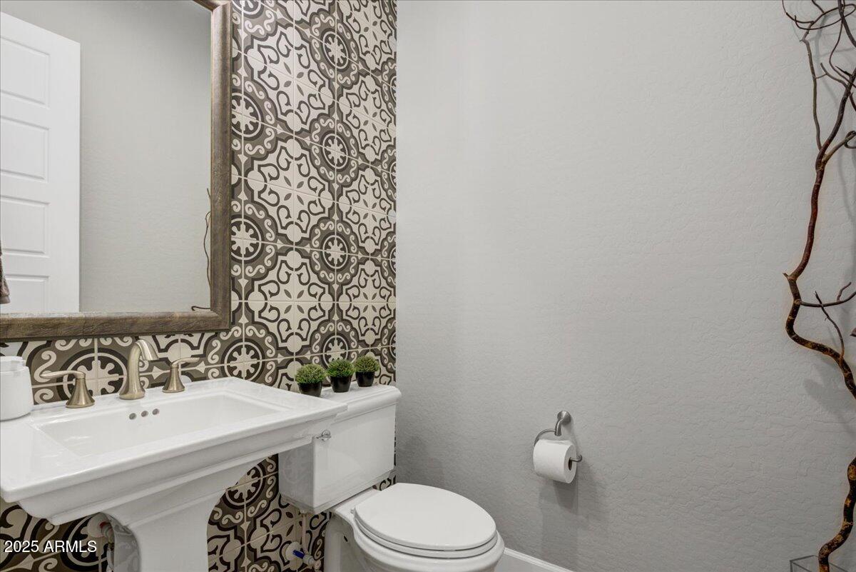 17833 East StockingTrail Rio Verde, AZ 85263 - Photo 27 of 45 a bathroom with a sink a toilet and shower