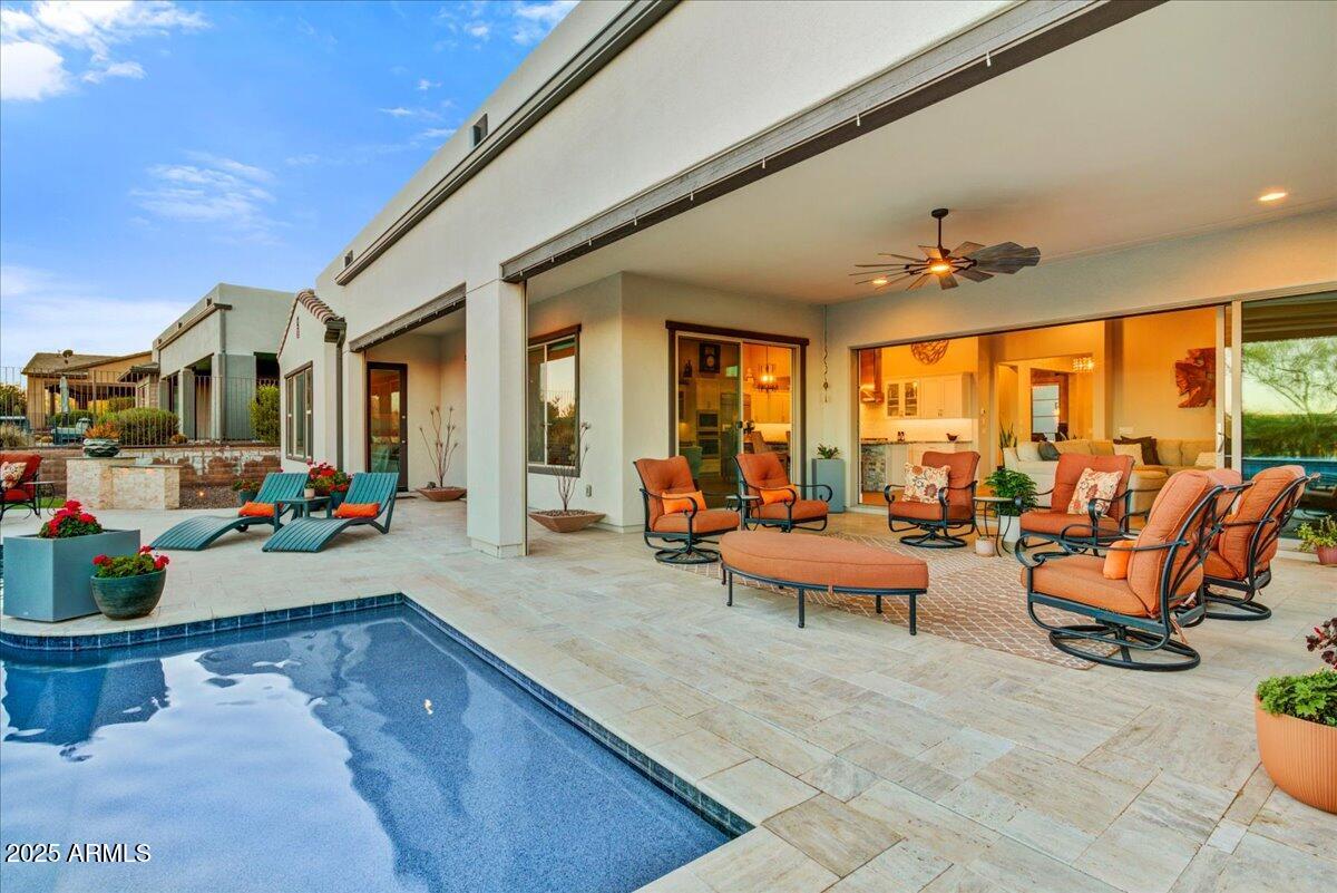 17833 East StockingTrail Rio Verde, AZ 85263 - Photo 31 of 45 a view of a patio with dining table and chairs with plants