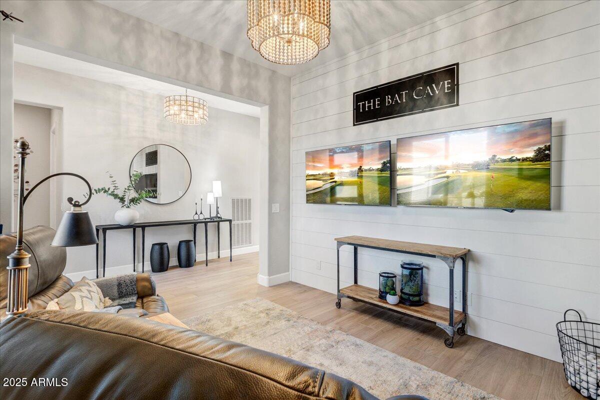 17833 East StockingTrail Rio Verde, AZ 85263 - Photo 5 of 45 a bedroom with a bed a mirror and paintings on the wall