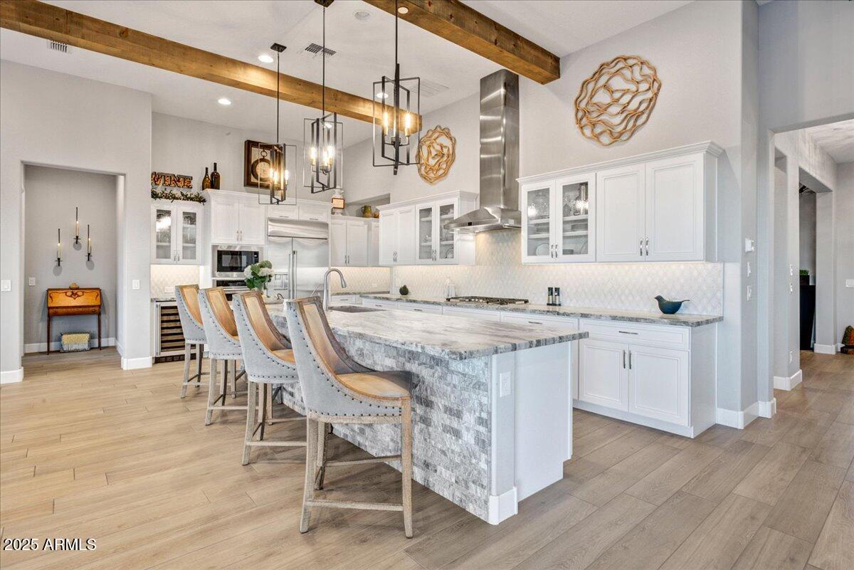 17833 East StockingTrail Rio Verde, AZ 85263 - Photo 6 of 45 a open kitchen with stainless steel appliances granite countertop a kitchen island hardwood floor and a sink