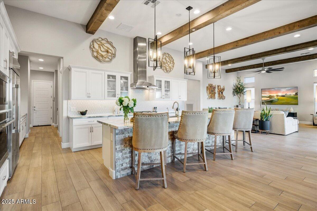 17833 East StockingTrail Rio Verde, AZ 85263 - Photo 9 of 45 a view of a dining room with furniture and wooden floor
