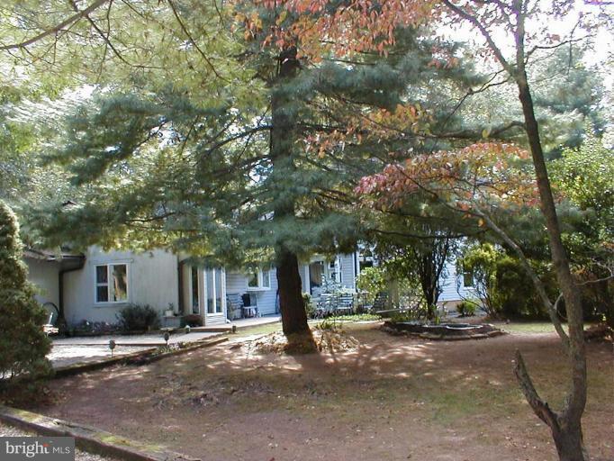 9509 Hall Road Potomac, MD 20854 - Photo 1 of 20 a front view of a house with a tree