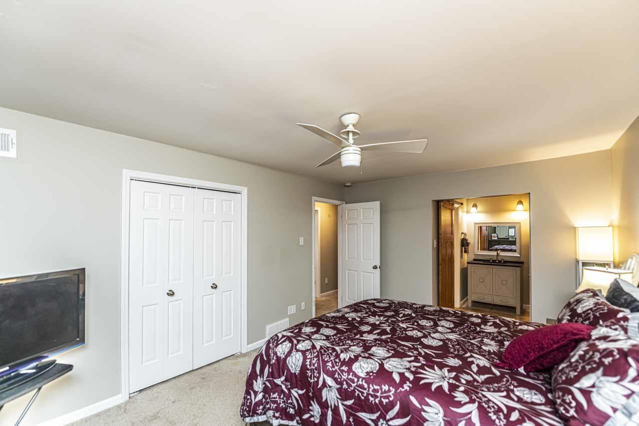 6910 Petworth Road, Unit 6910 Memphis, TN 38119 - Photo 19 of 37 a bedroom with a bed and a flat screen tv