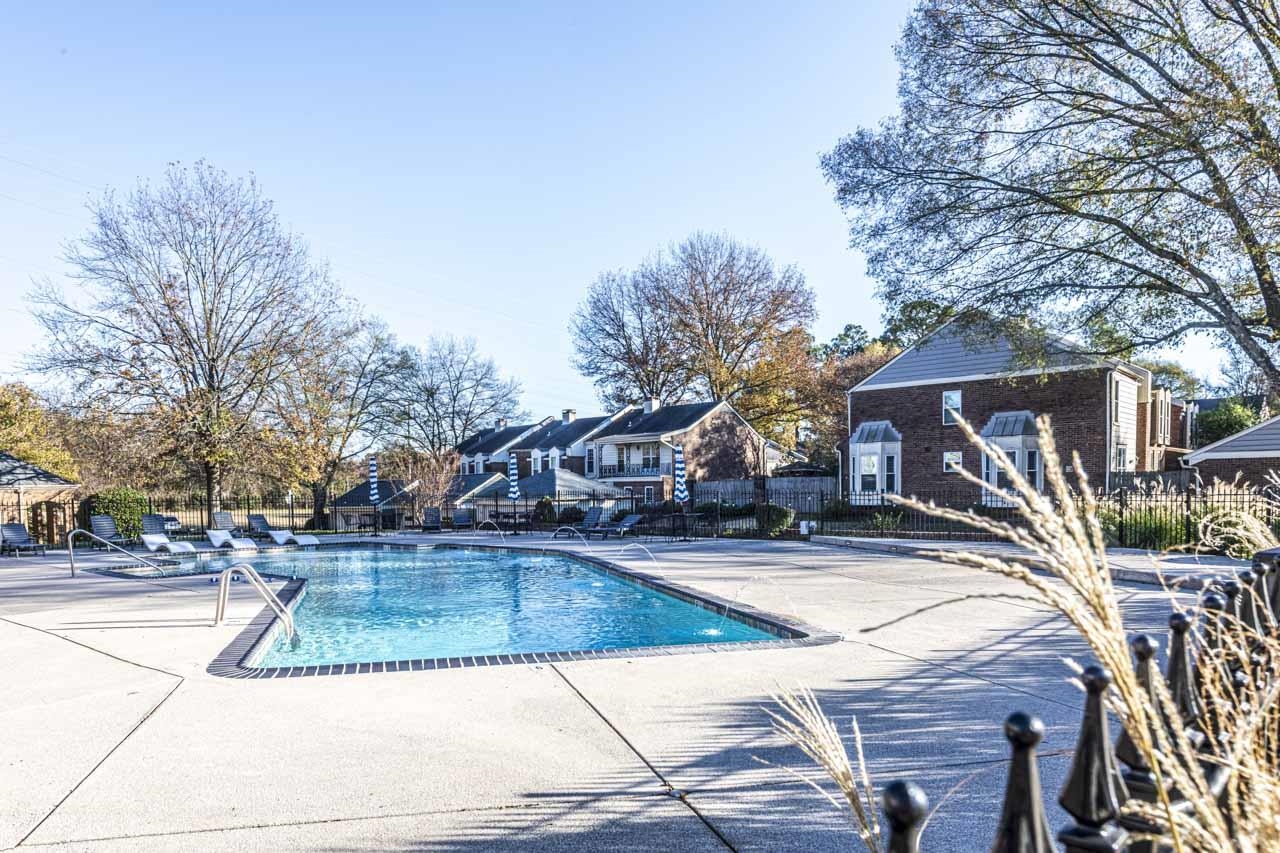 6910 Petworth Road, Unit 6910 Memphis, TN 38119 - Photo 4 of 37 a view of a white house with a yard and sitting area
